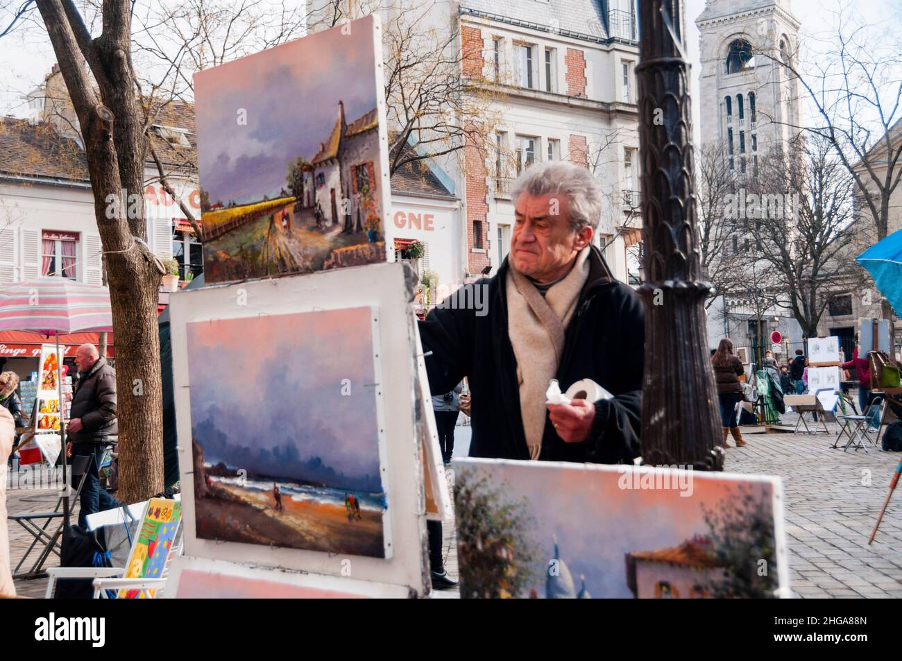 French artist painting on Place du Terre or Artist's Square in the Montmartre, Paris. Stock Photo