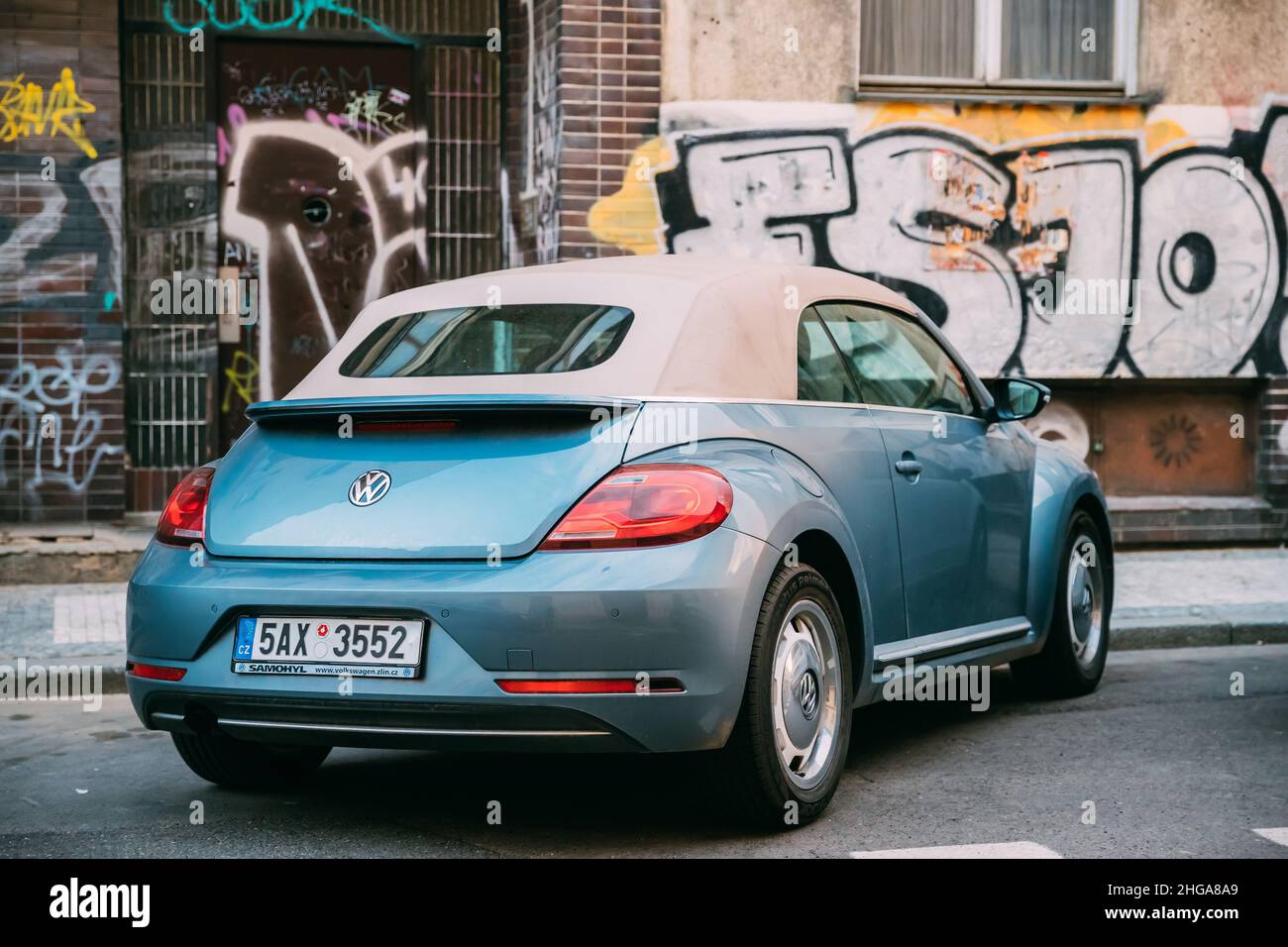 Side View Of Blue Volkswagen New Beetle Cabriolet Car Parked In Street ...