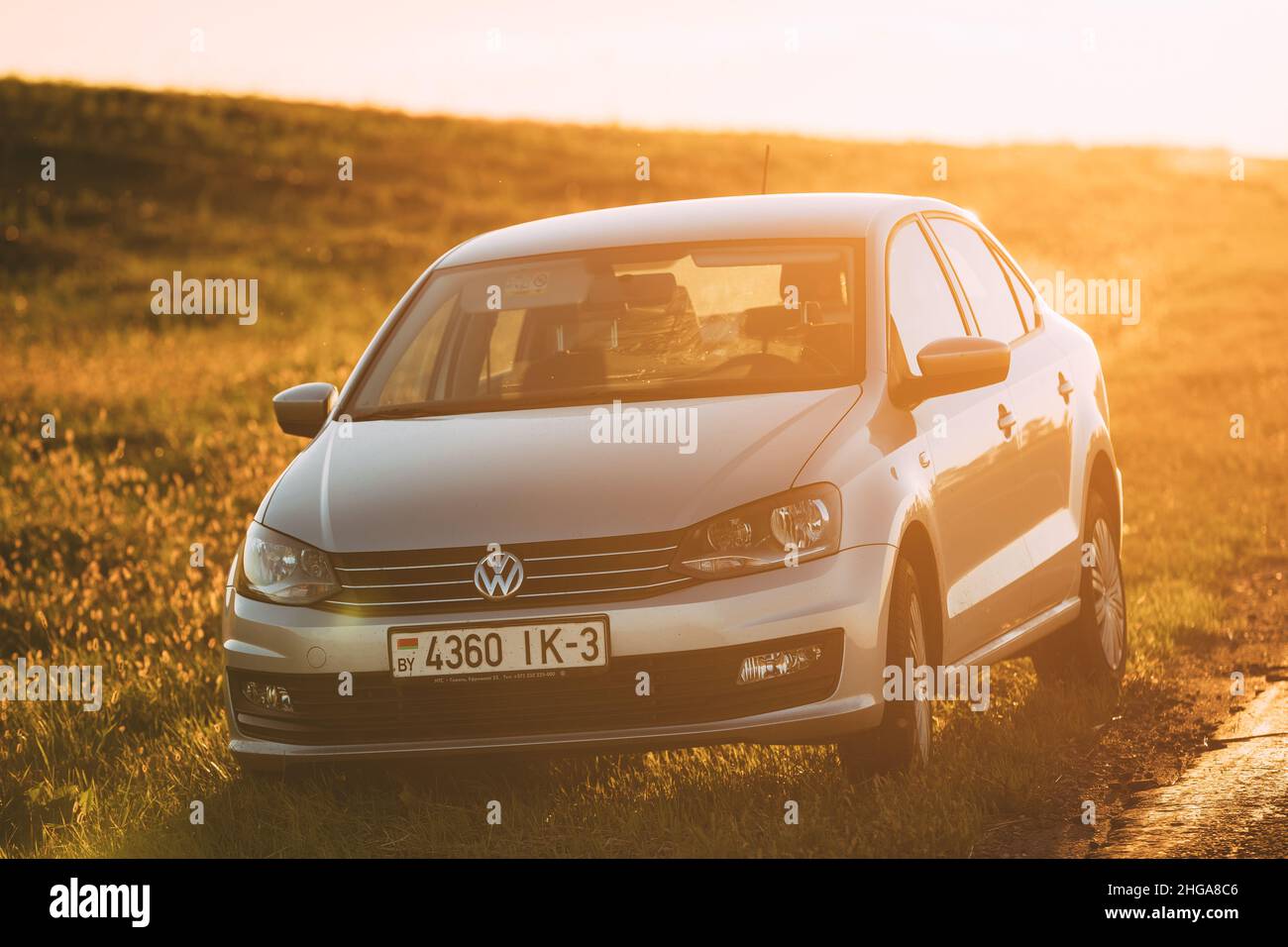 Volkswagen Polo Car Parking On A Roadside Of Country Road During Sunset ...