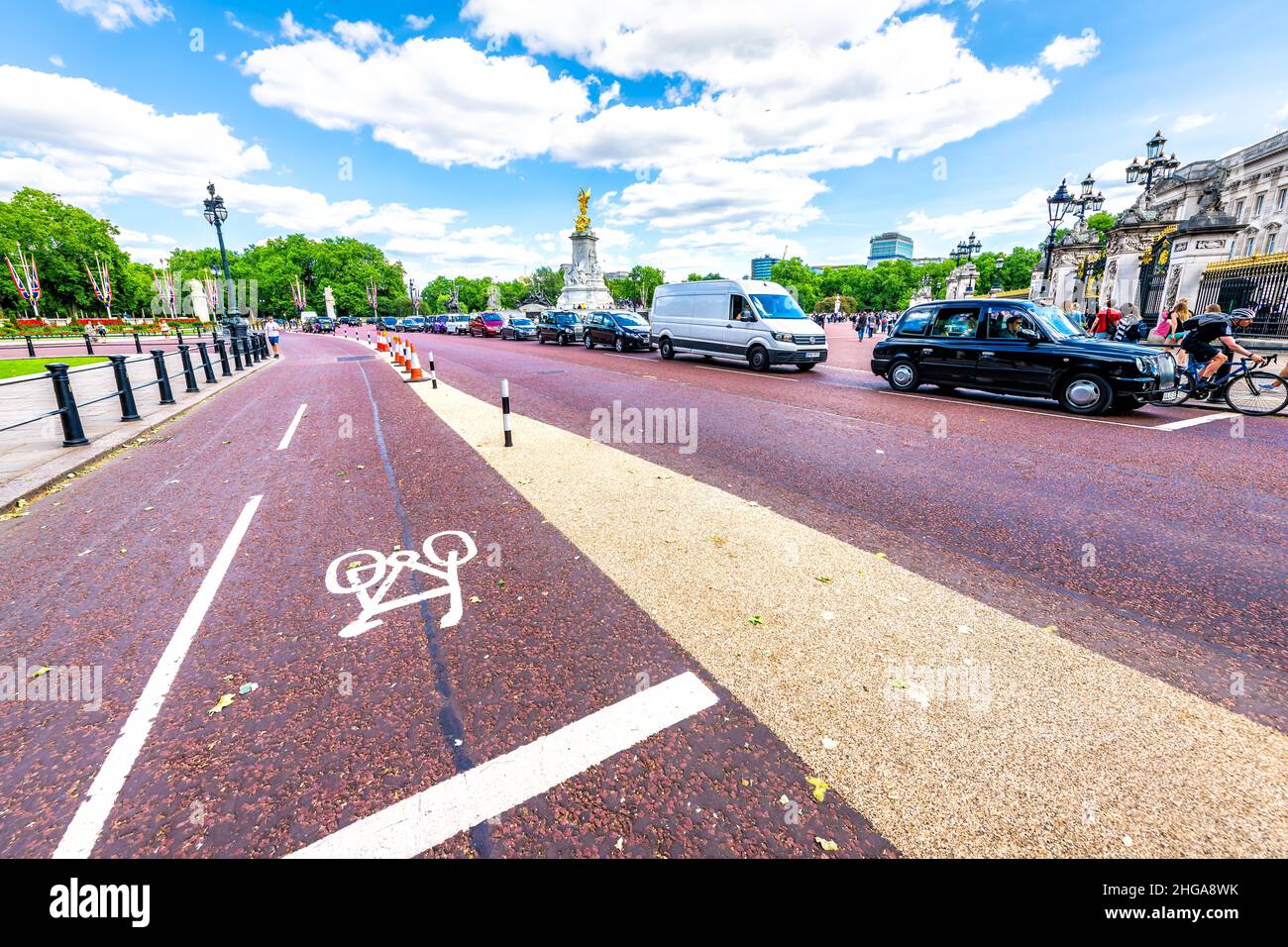 London, UK - June 21, 2018: Road street roundabout wide angle closeup of bicycle lane at Buckingham Palace with Victoria Monument in summer Stock Photo
