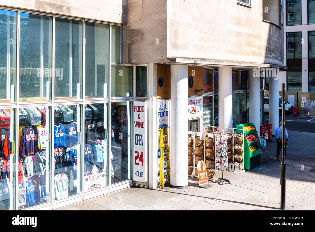 London, UK - June 22, 2018: Neighborhood local store A.P. food express grocery shopping storefront facade exterior entrance with souvenir shirts Stock Photo