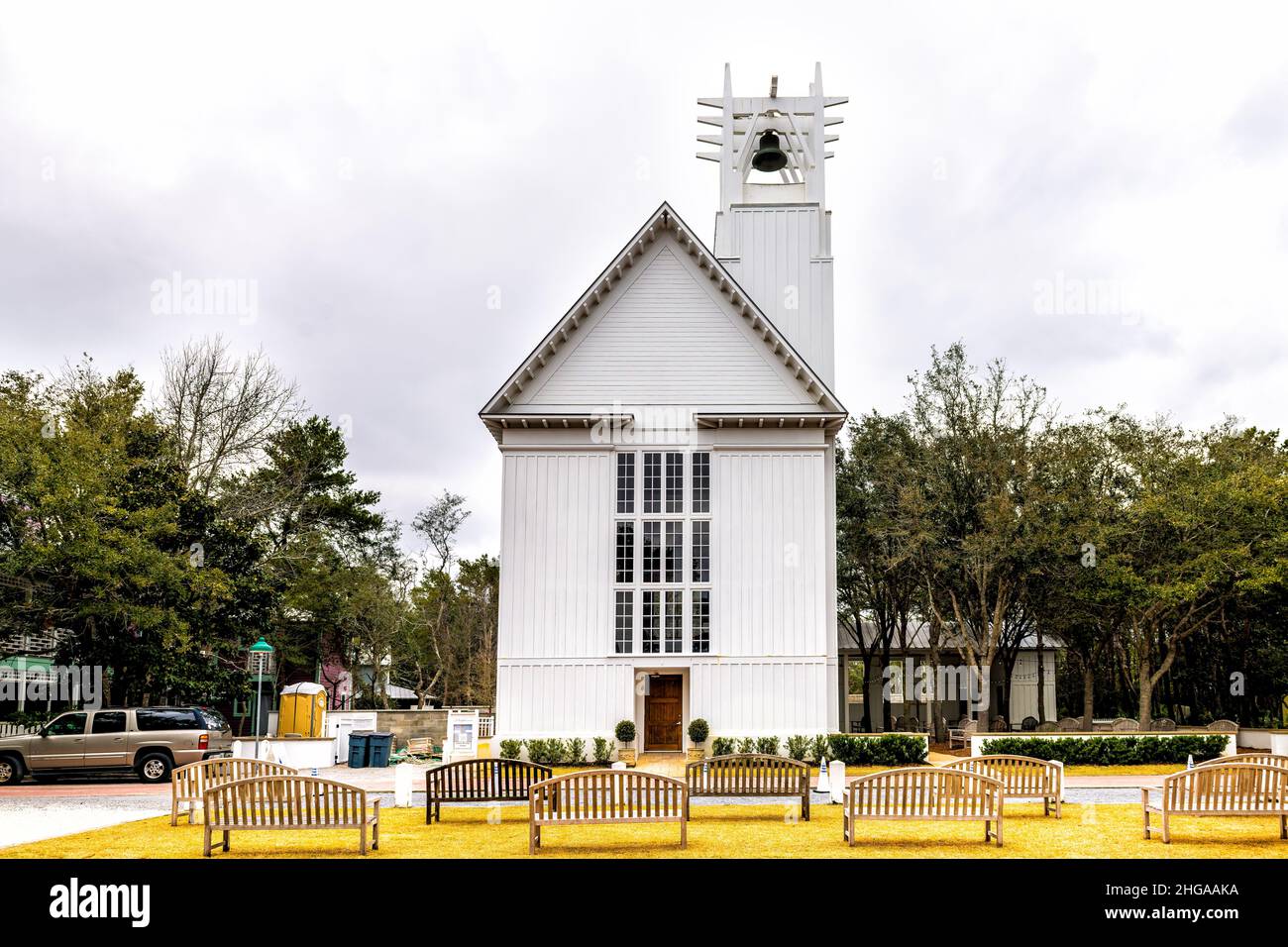 Seaside, USA - January 12, 2021: Seaside, Florida coastal city street with panel of church Chapel wooden white architecture new urbanism style on clou Stock Photo