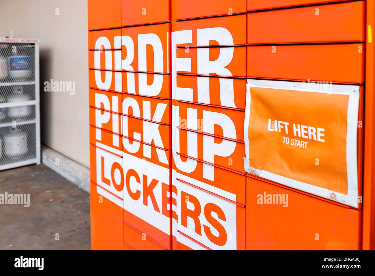 Naples, USA - August 14, 2021: The Home Depot store with orange color sign on order pickup lockers in Naples, Florida for online pick up and lift here Stock Photo