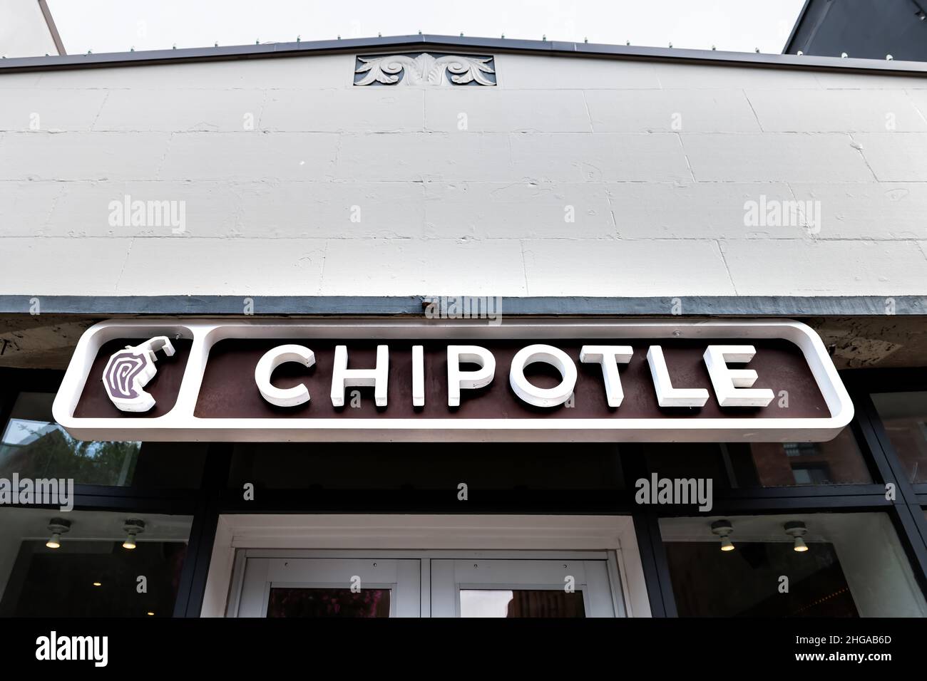 Washington DC, USA - August 18, 2021: Georgetown M street nobody sign closeup for Chipotle Mexican fast food healthy restaurant building exterior serv Stock Photo