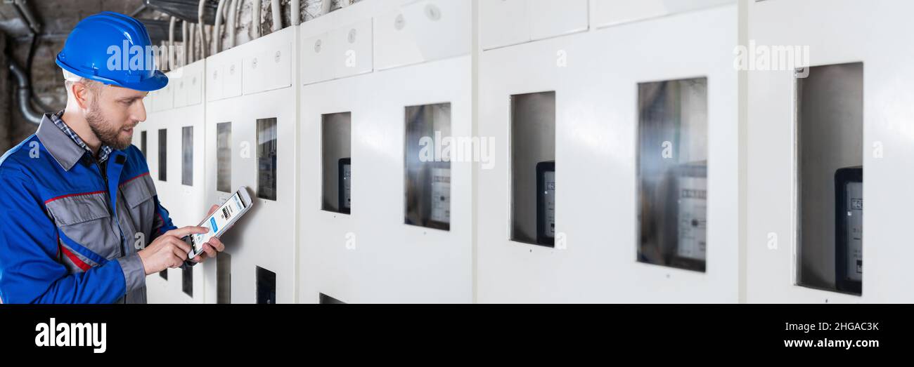 Male Technician Doing Meter Reading Using Tablet Stock Photo Alamy