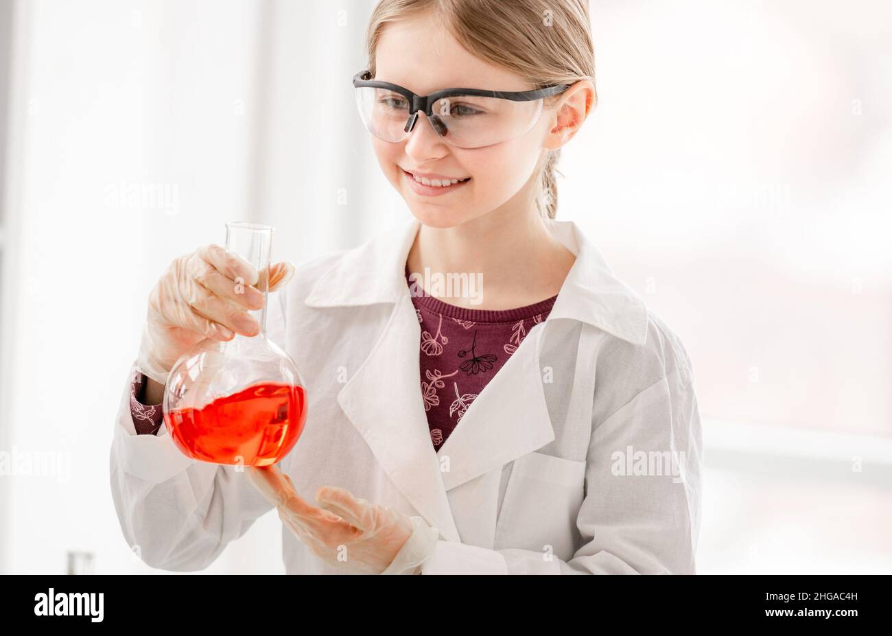 Girl on chemistry lesson Stock Photo
