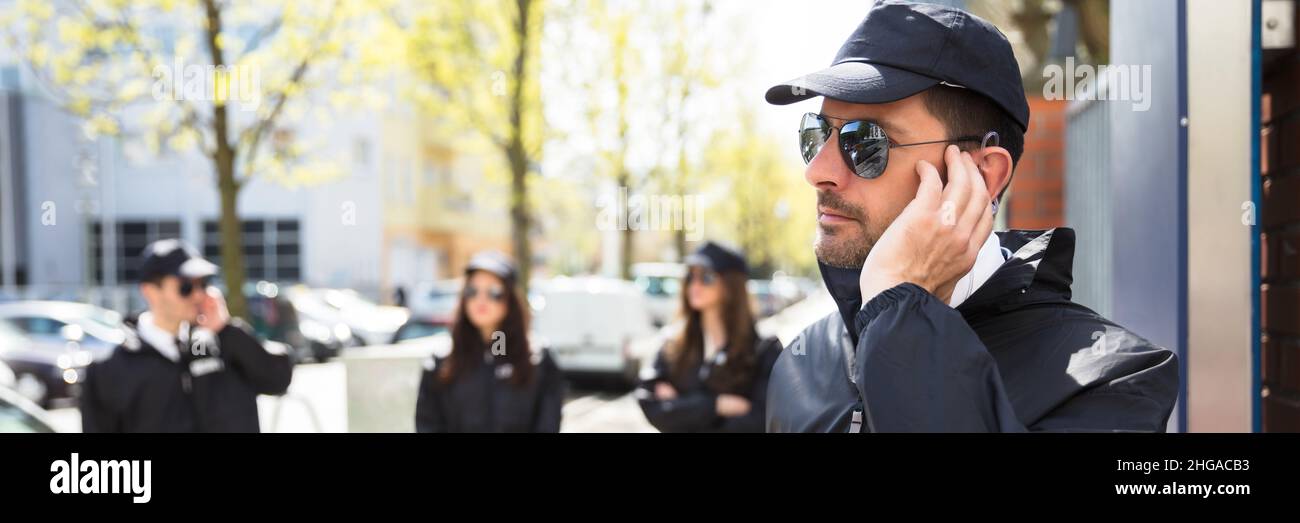 Security Guard Protection Staff At Event. Bodyguard Group Stock Photo