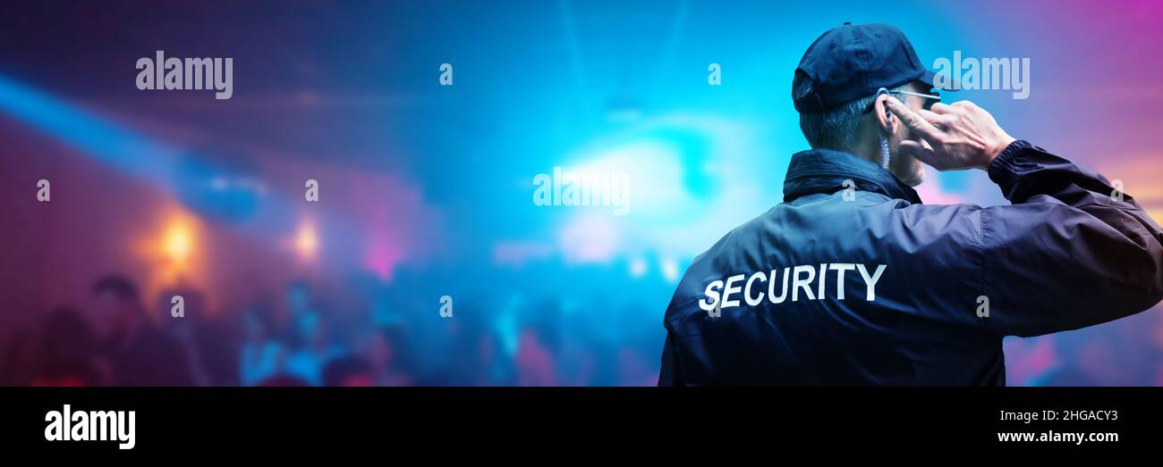 Security Guard At Club Event Or Concert. Bouncer At Night Stock Photo