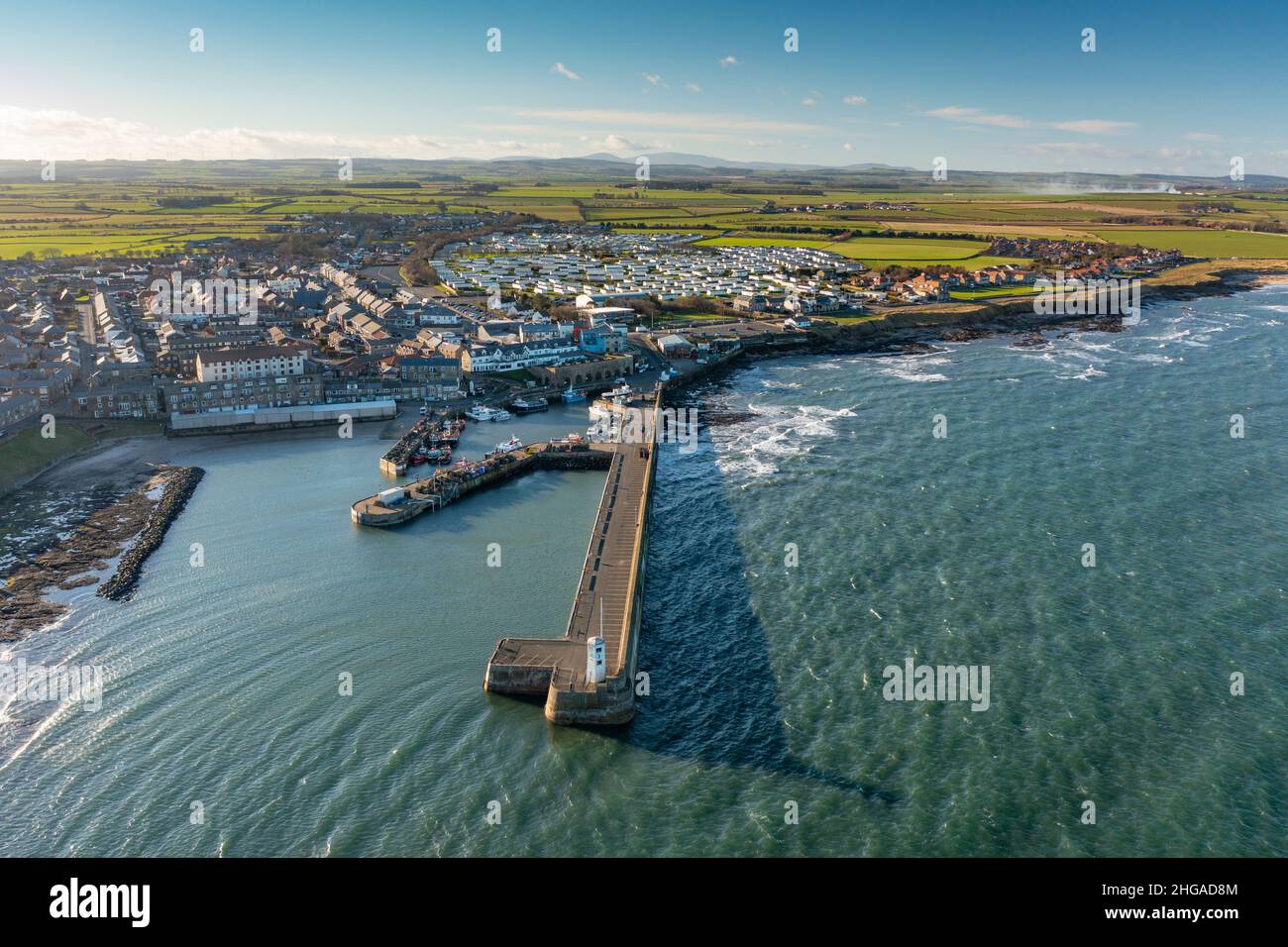 Aerial view from drone of Seahouses fishing harbour in Northumberland ...