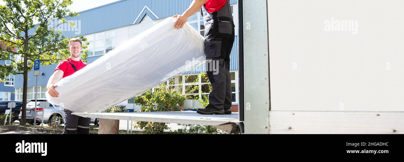 Mattress Move And Delivery Using Mover Truck. Furniture Transport Stock