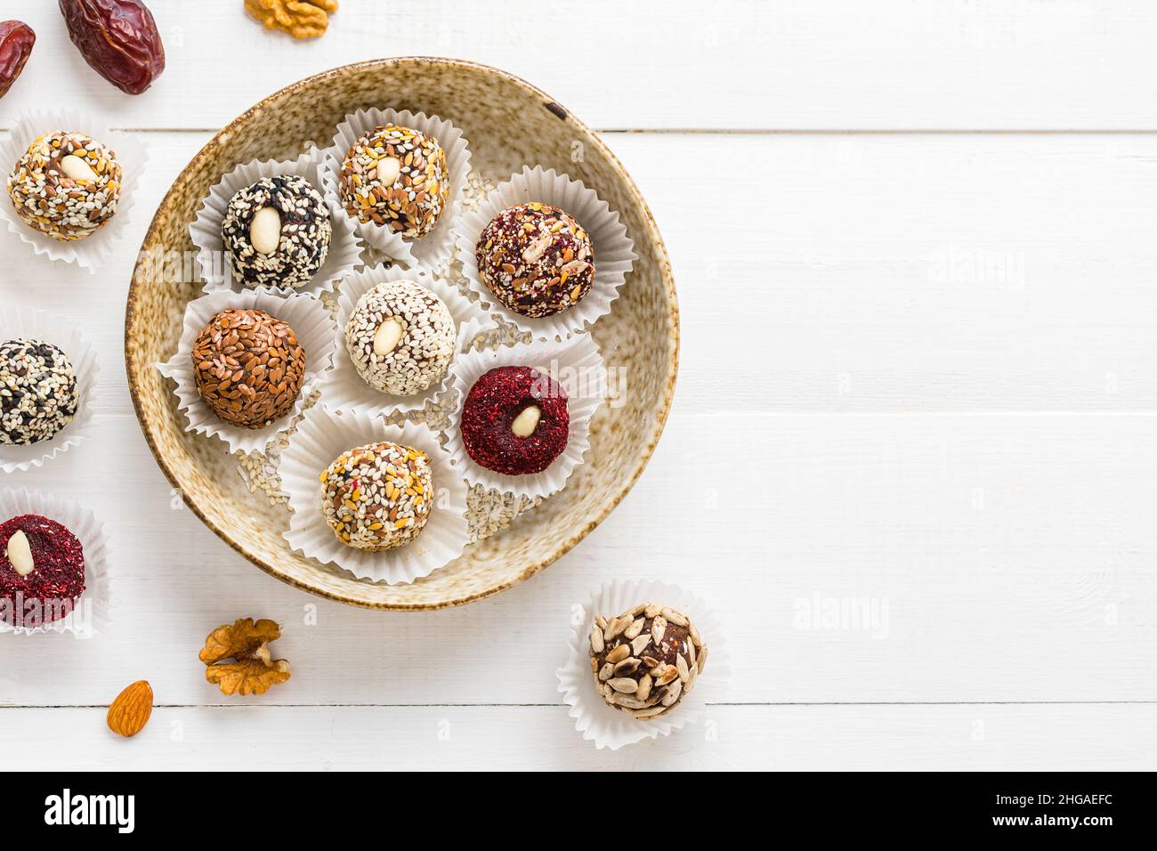 Vegan candies made from nuts and dried fruits. Energy ball. copy space Stock Photo