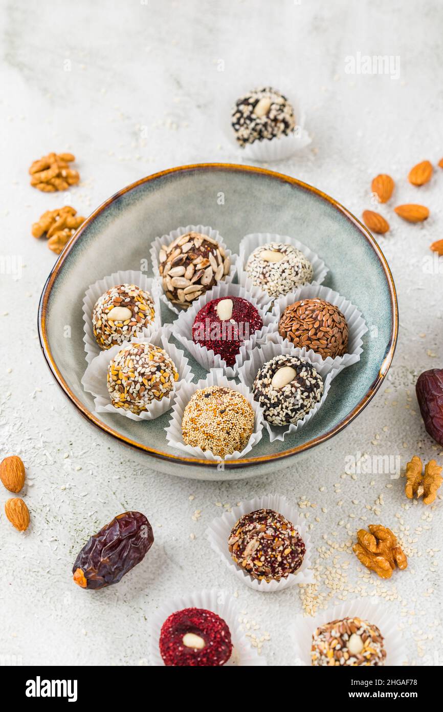 Vegan candies made from nuts and dried fruits. Energy ball. copy space Stock Photo