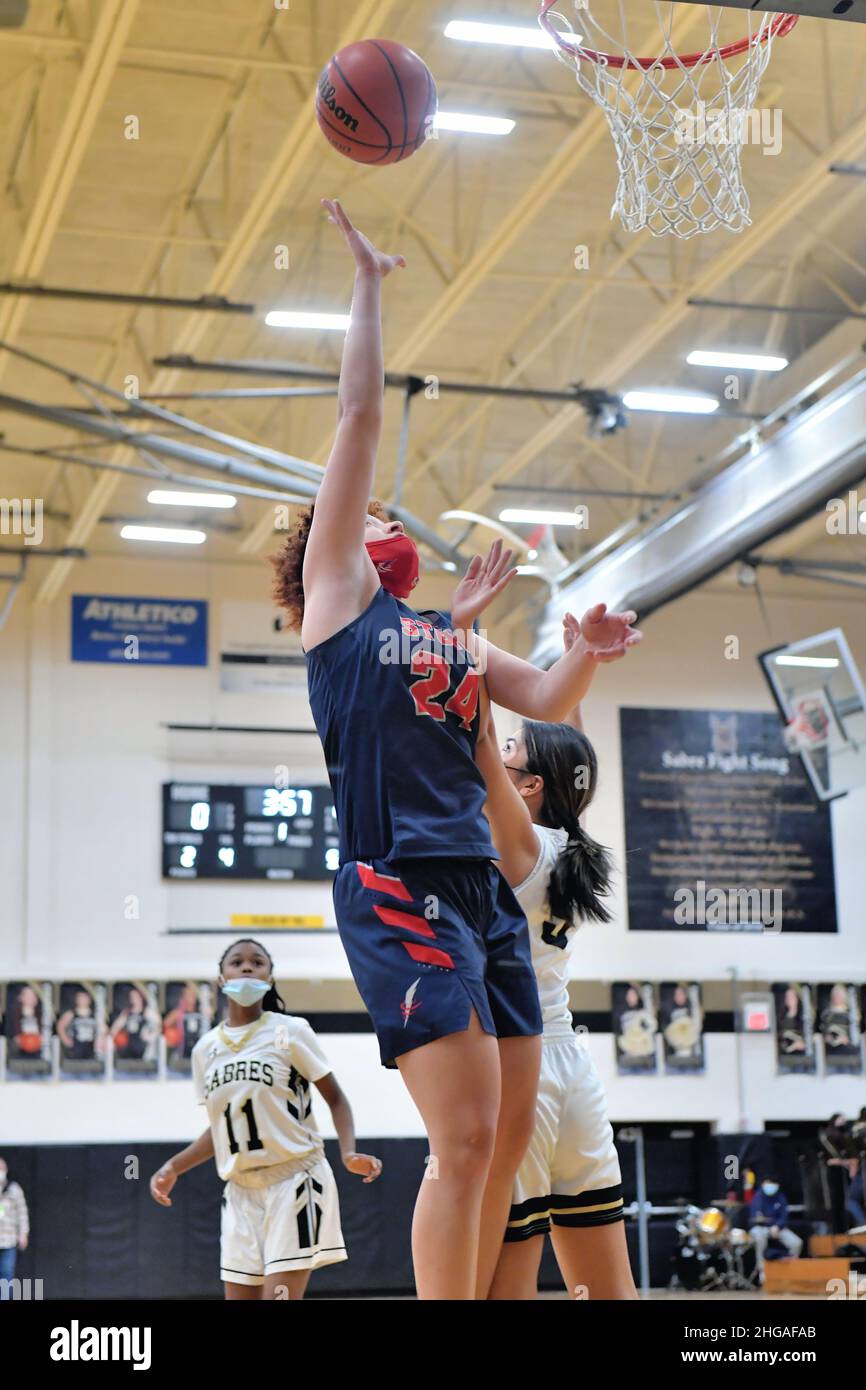 USA. Player rising well above the floor to record two points for her team. Stock Photo