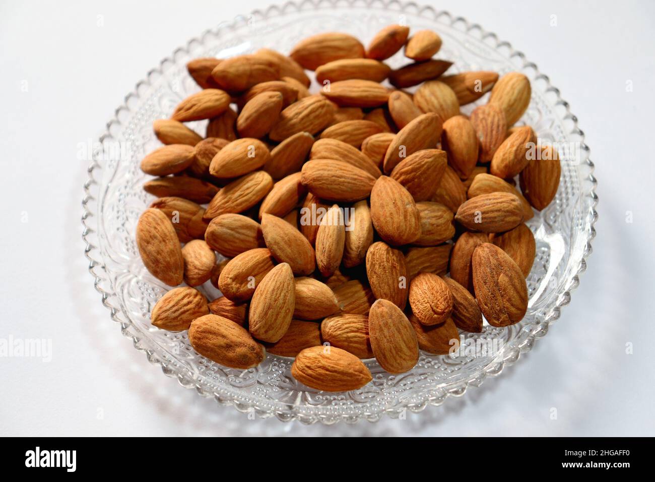 Almond on a plate with white background,healthy food for control blood