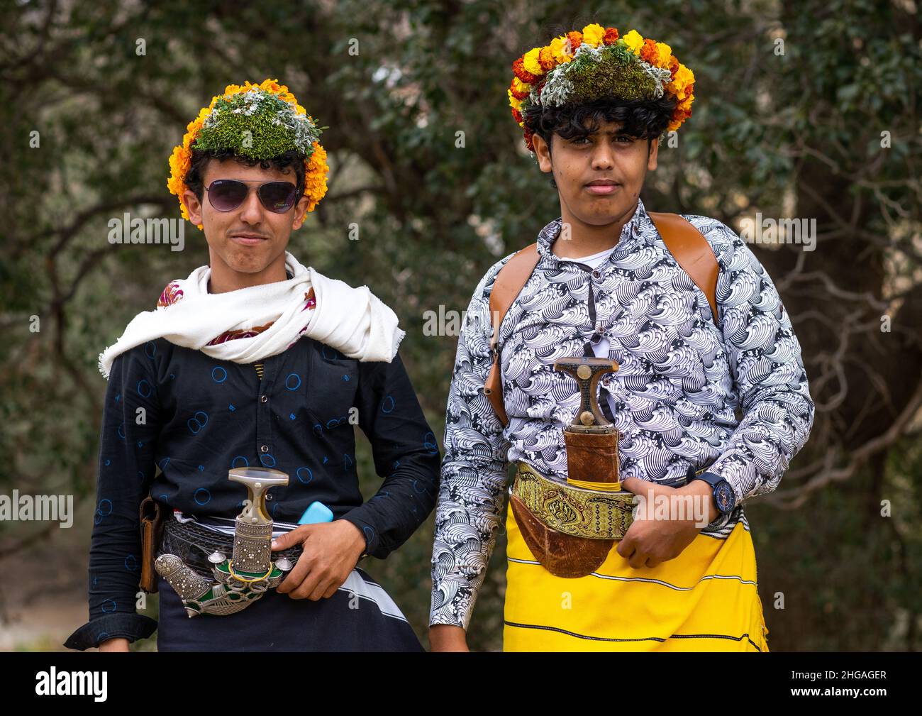 Portrait of flower men wearing floral crowns on the head, Asir province, Sarat Abidah, Saudi Arabia Stock Photo