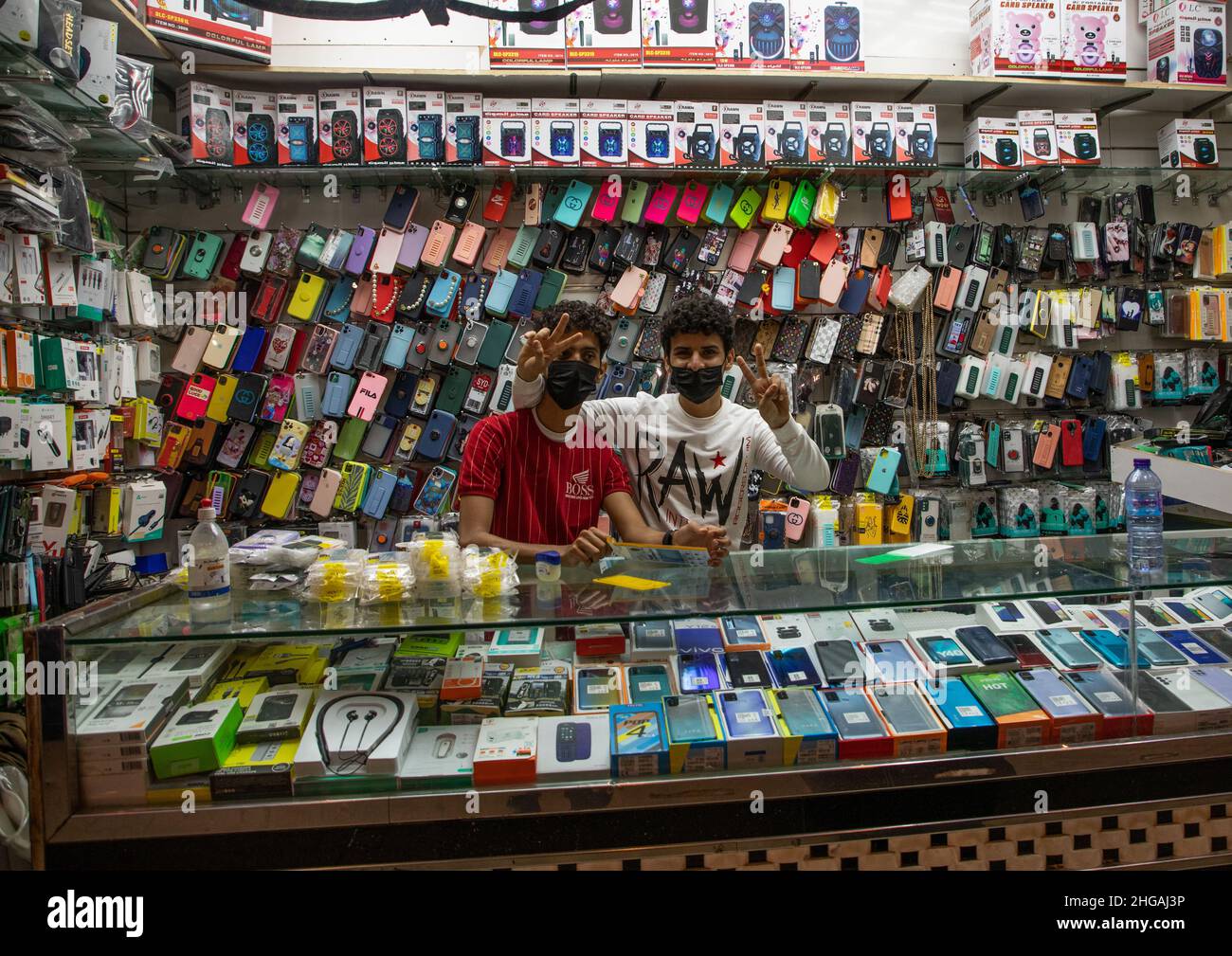 Sellers in a mobile phone shop, Jizan Province, Jizan, Saudi Arabia Stock Photo