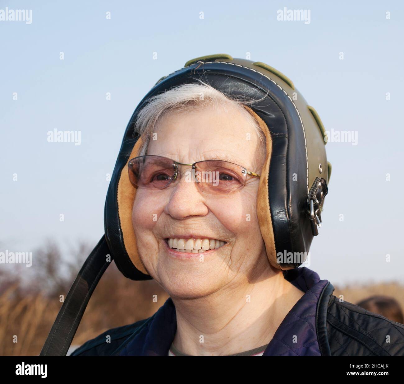 Smilling elderly lady in helmet Stock Photo