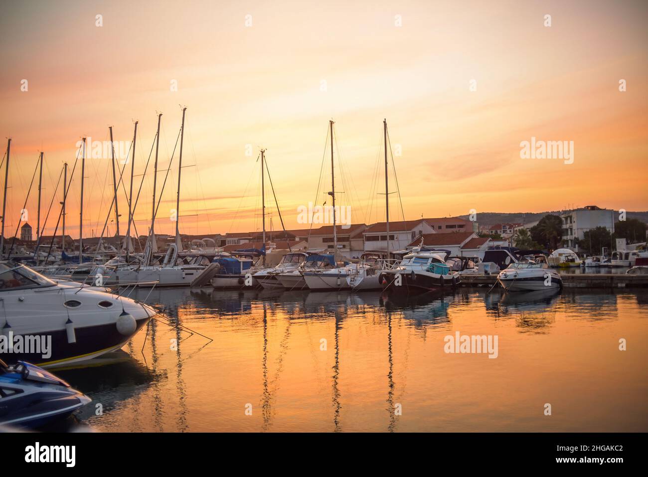 There are many yachts, boats and ships at sea. Marina at sunset. Vosice Croatia Gorgeous summer sunset by the ocean Stock Photo