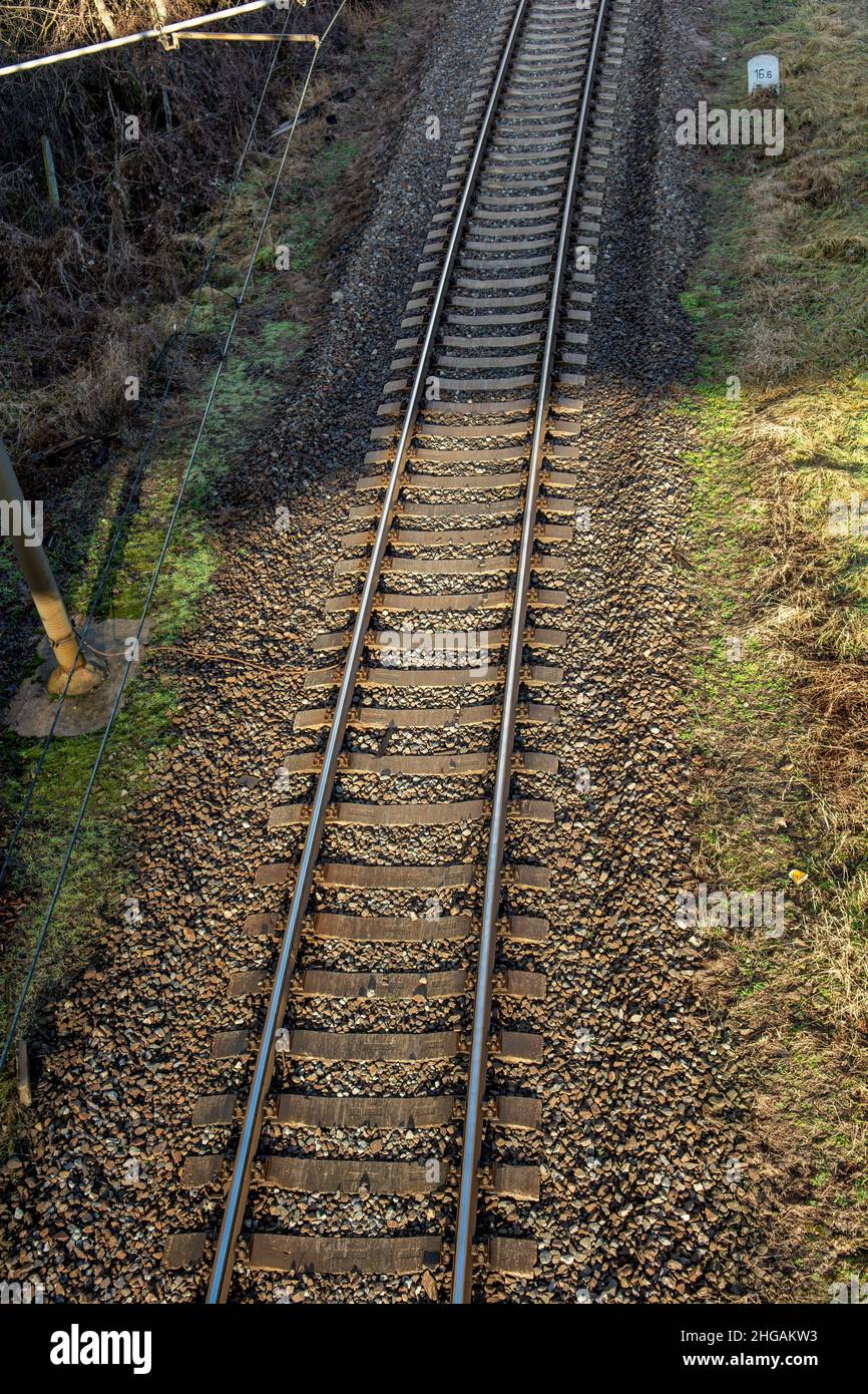 Single track railway line. Empty straight single-way railway line at sunny day. Stock Photo