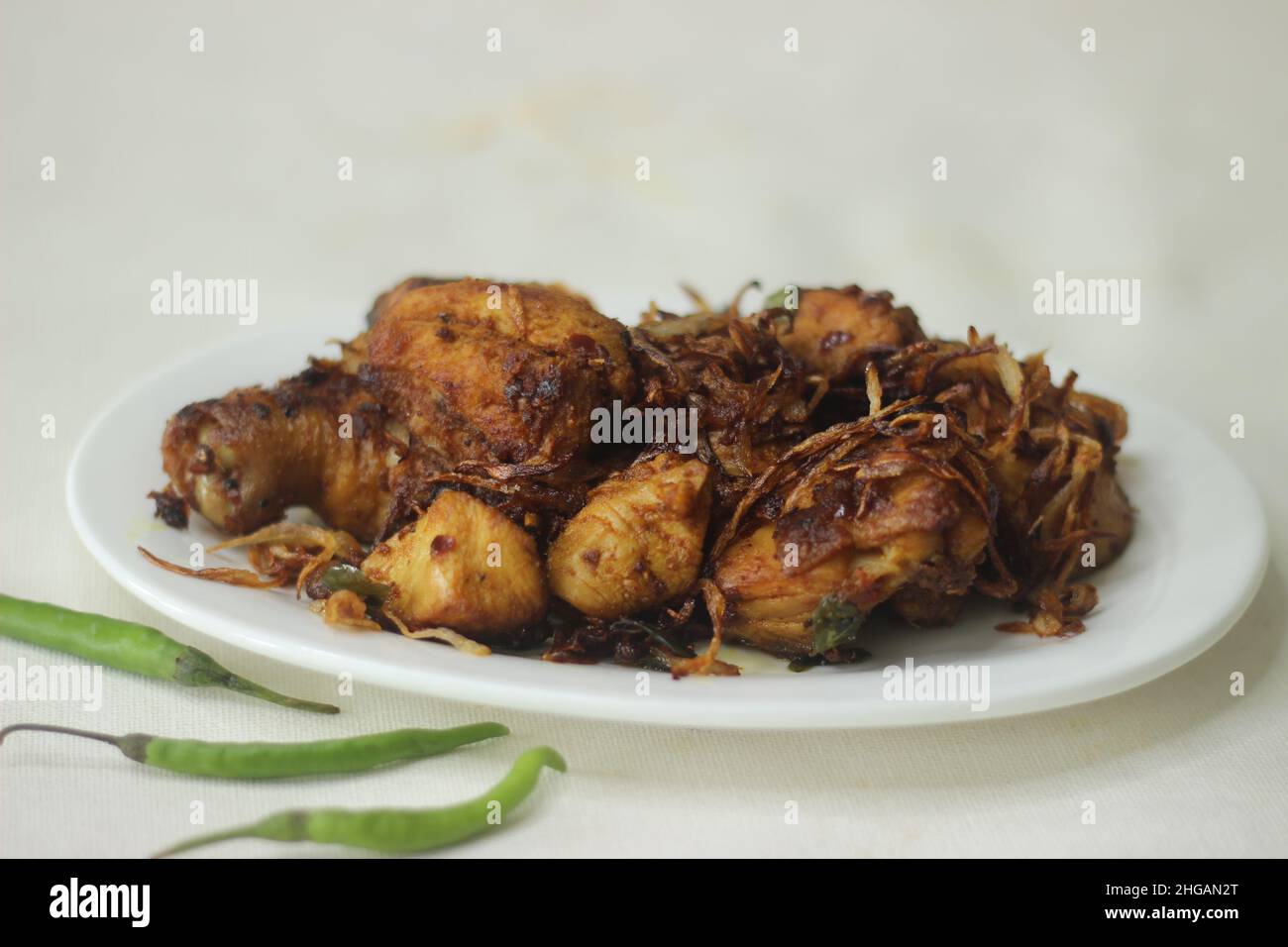 Chicken roast. Chicken prepared in Kerala style with onions tomatos and