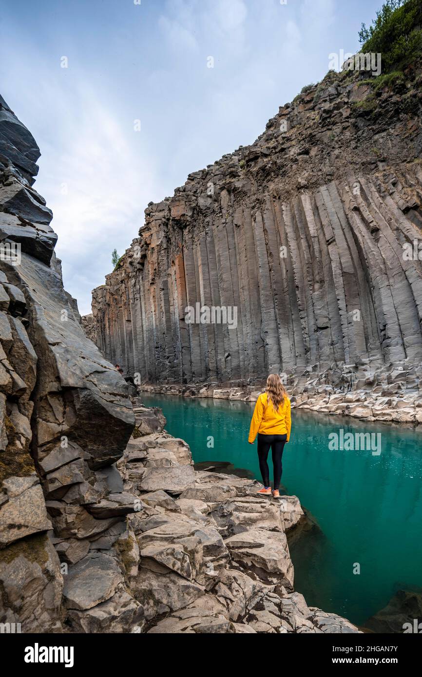 Tourist at Stuolagil Canyon, basalt columns, Egilsstadir, Iceland Stock Photo