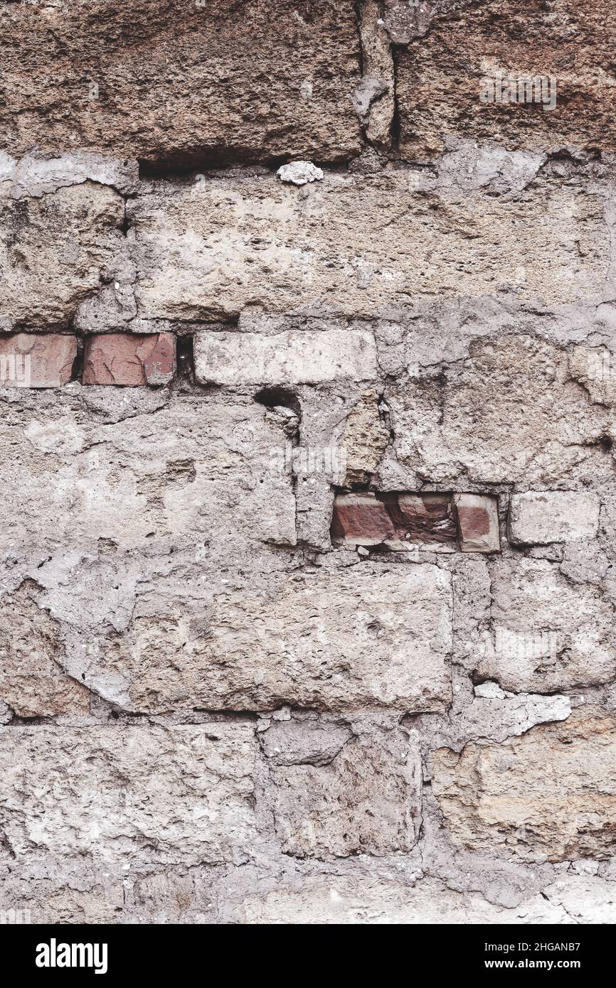 Abstract background old white brick wall with cracks and scratches ...