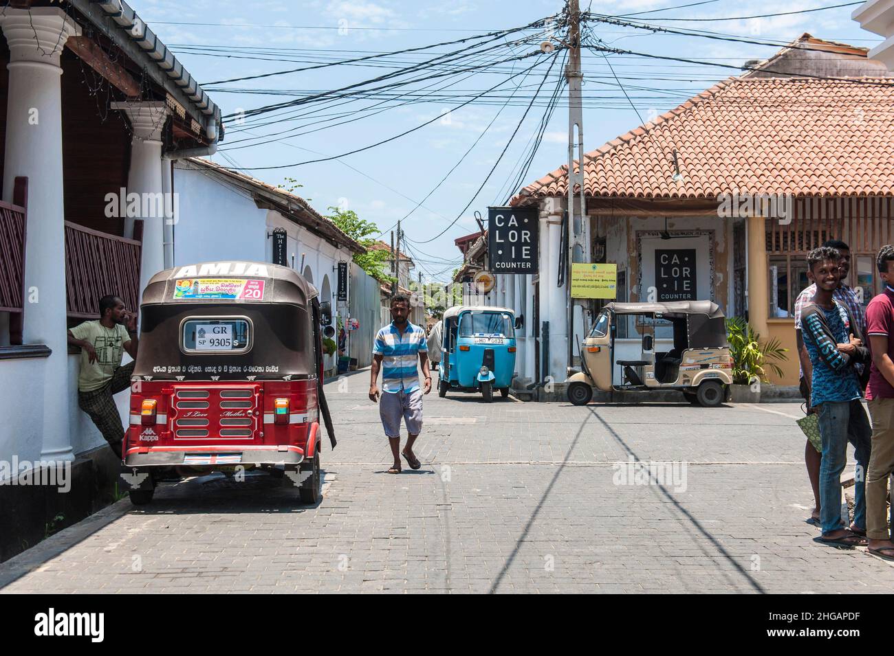 People and tuk tuks in the street, Galle Fort, Galle, Southern Province