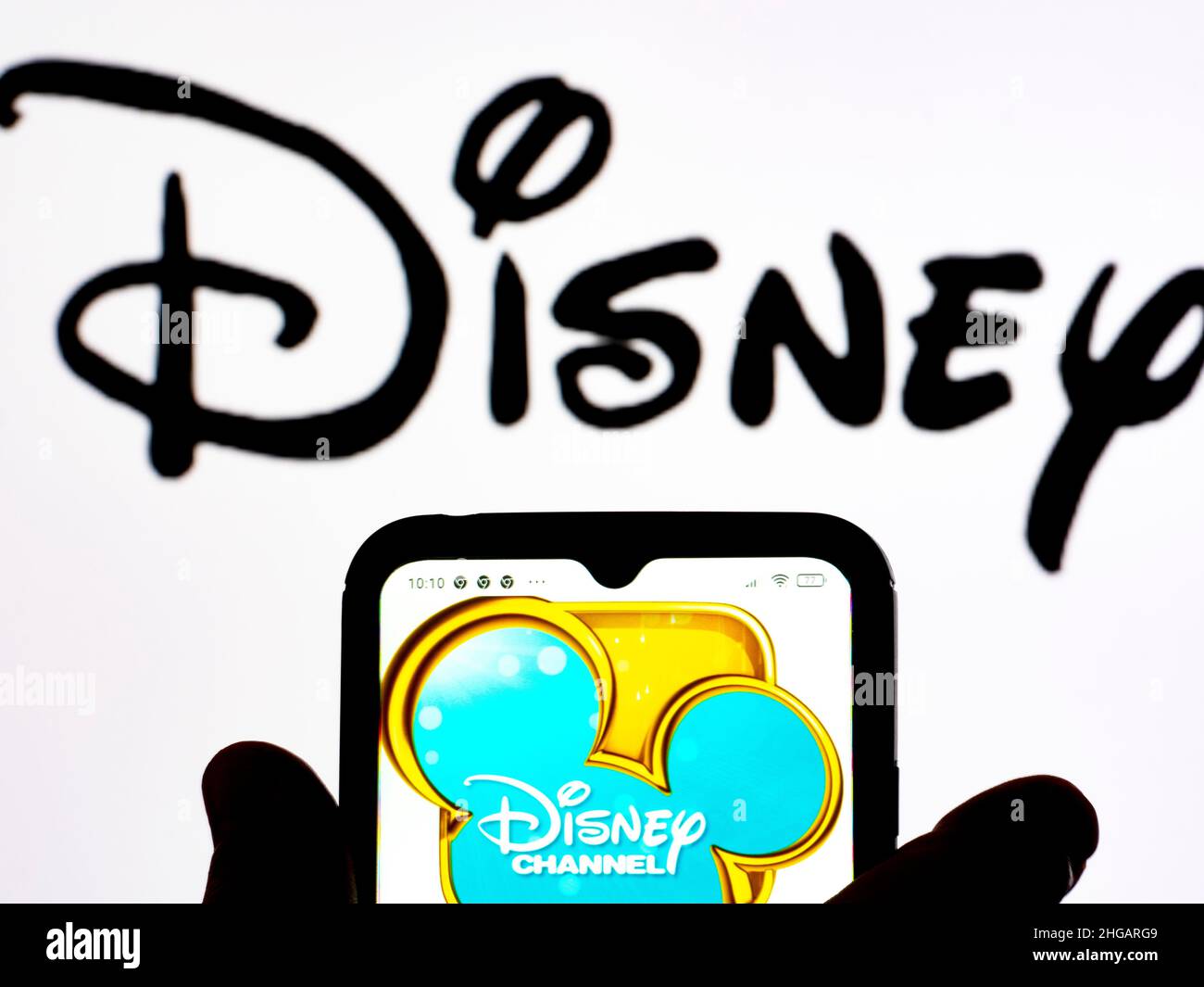 Ukraine. 19th Jan, 2022. In this photo illustration, the Disney Channel  logo is seen displayed on a smartphone screen with the Disney logo in the  background. (Photo by Igor Golovniov/SOPA Images/Sipa USA)
