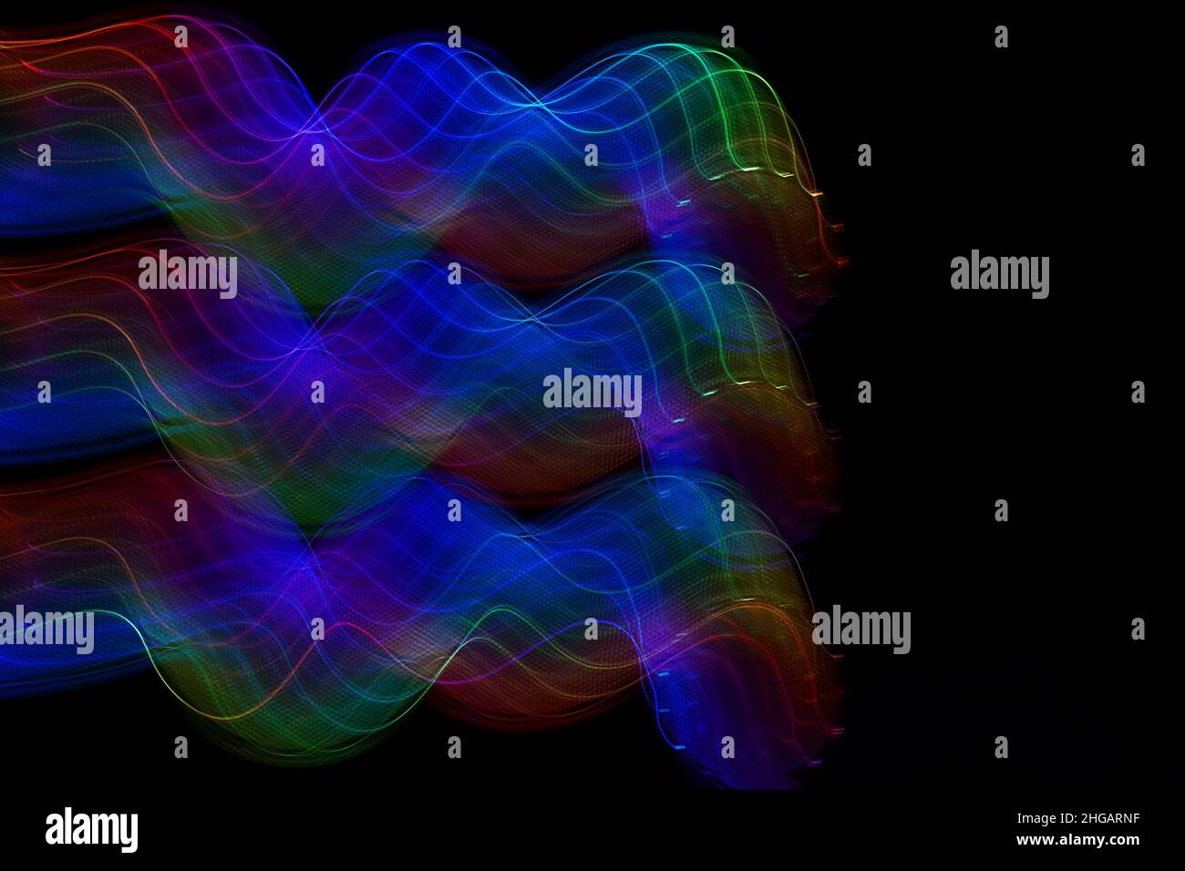 Neon wave pattern. Abstract lines isolated on a black background ...