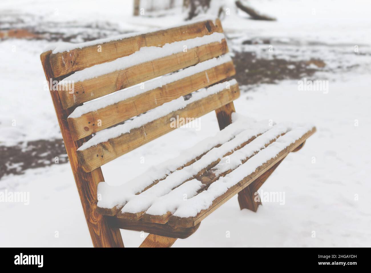 Bench in a park covered completely by snow after heavy snowfall Stock ...