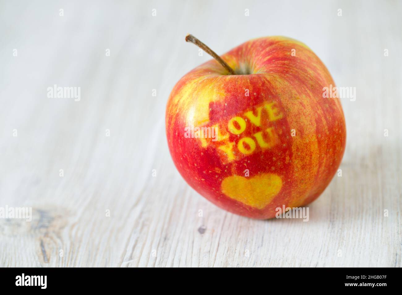 apple with heart and text 'i love you' Stock Photo