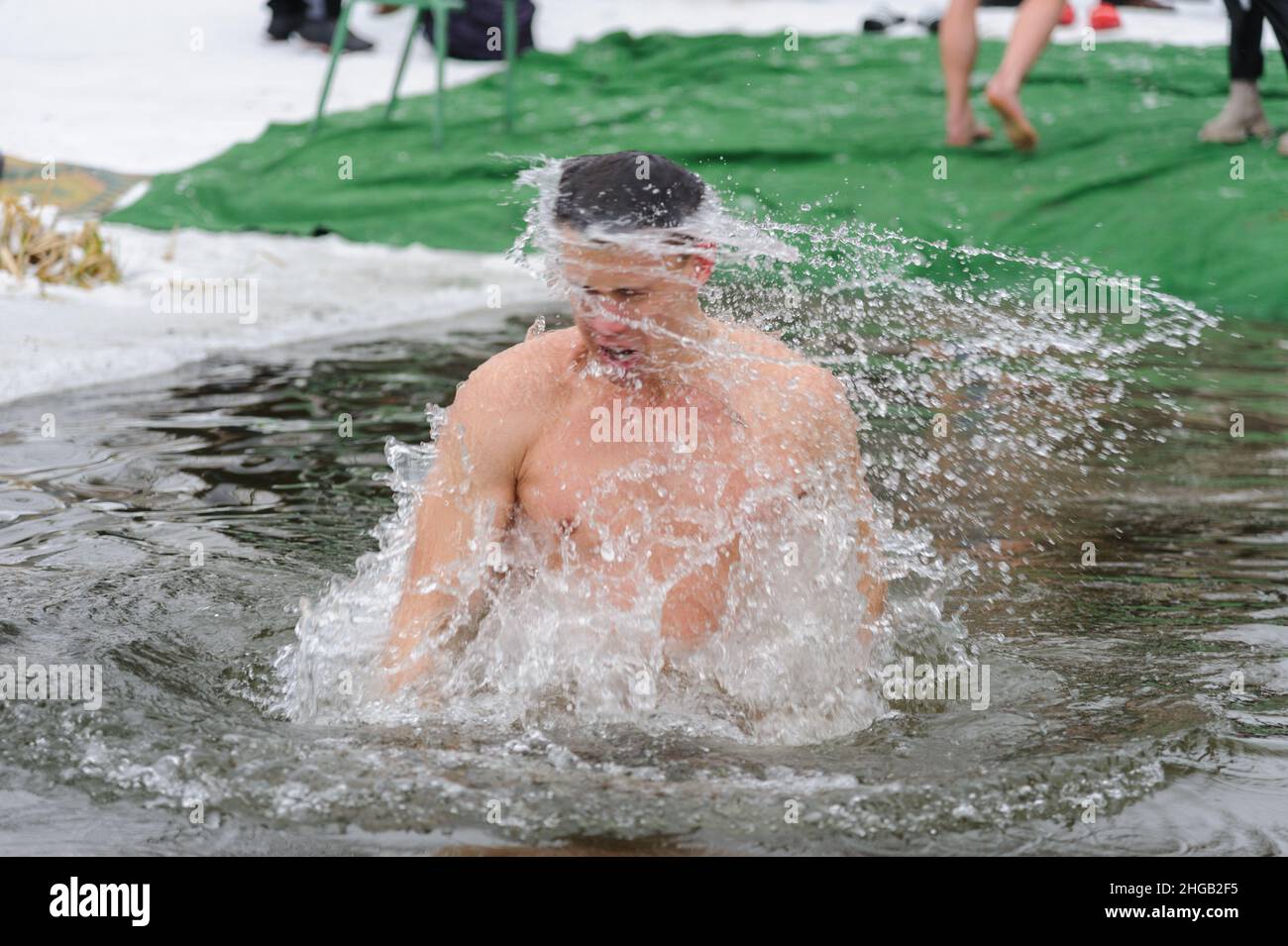 Lviv, UKraine. 19 January 2022. Man bathe in cold water during the