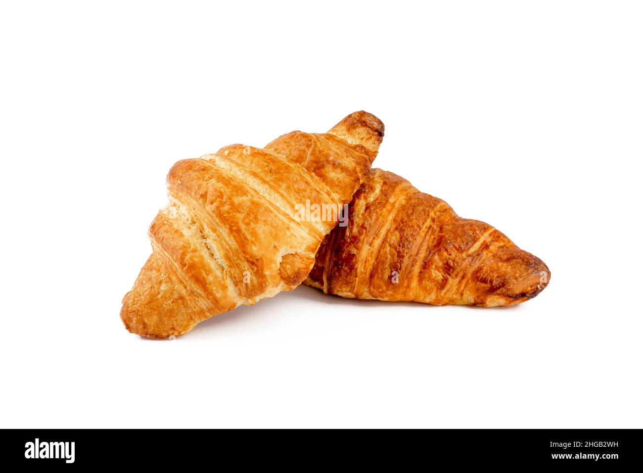 Two fresh croissants isolated on white background. Stock Photo