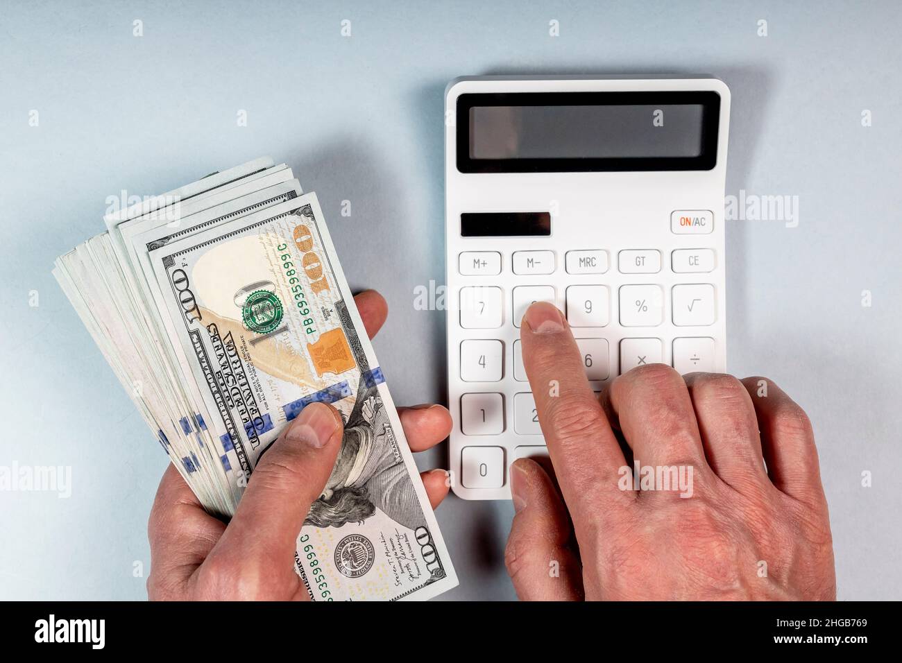 Calculating profit and income. Hand counting cash money. Personal ...