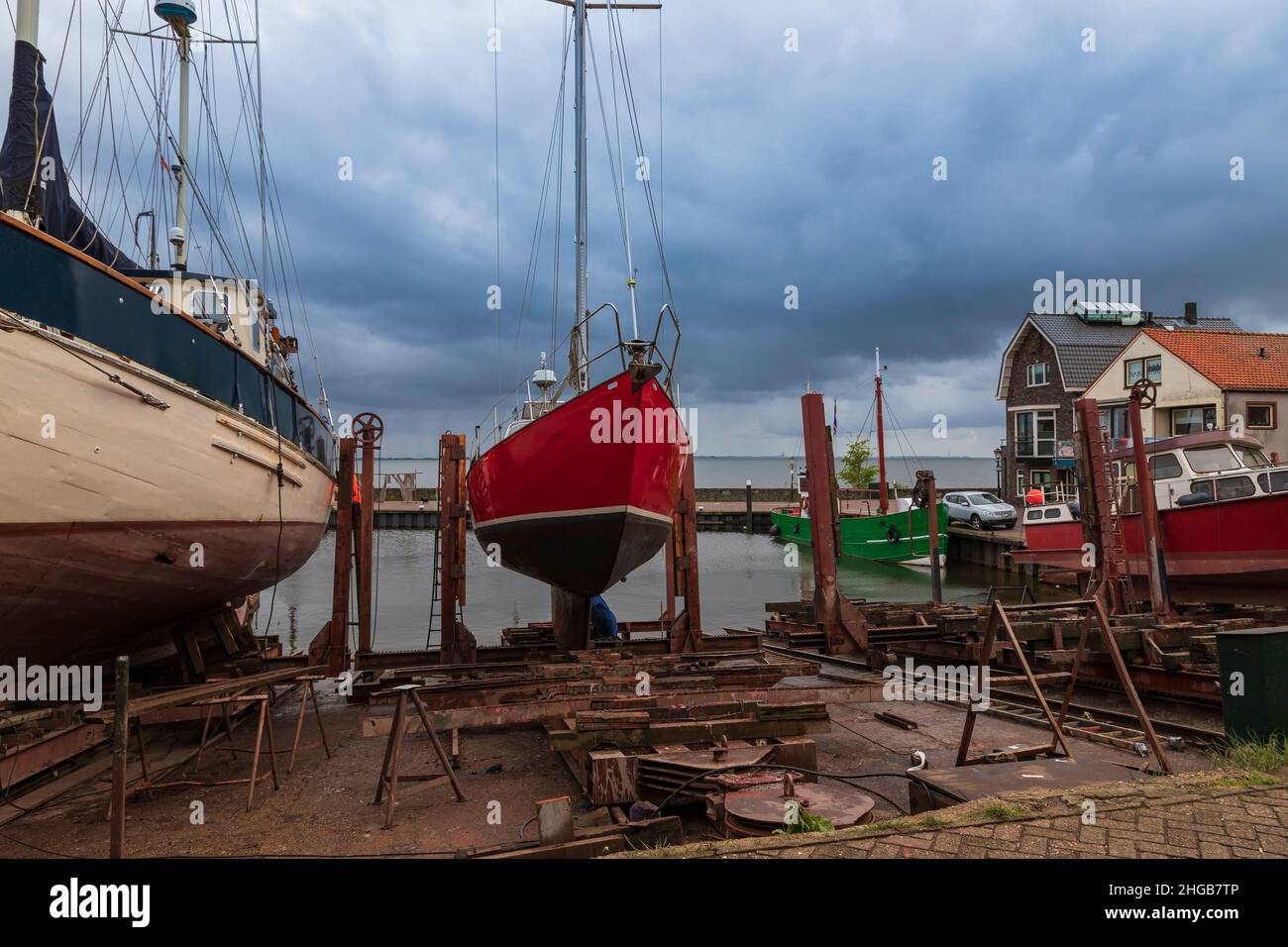 Boat at berth in Urk city in Holland. Docks where ships are repaired ...