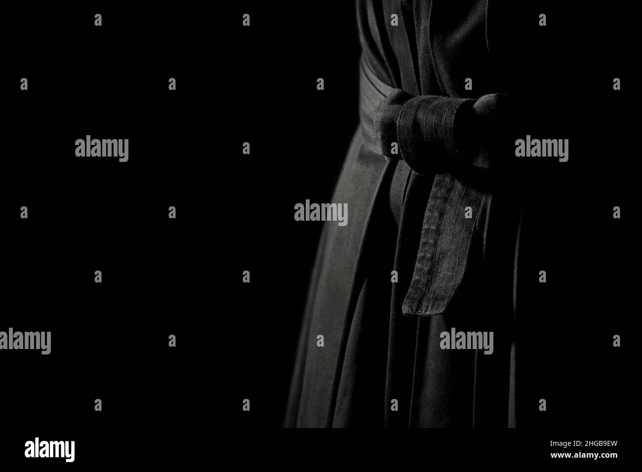 Aikido hakama, japanese martial arts uniform on black background. Shallow depth of field. SDF. Stock Photo