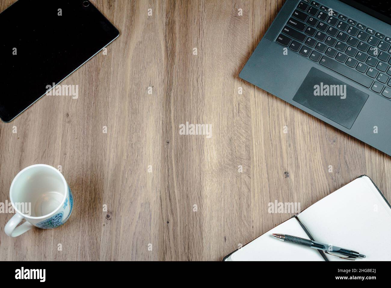 Home office desk workspace with a computer and writing materials Stock