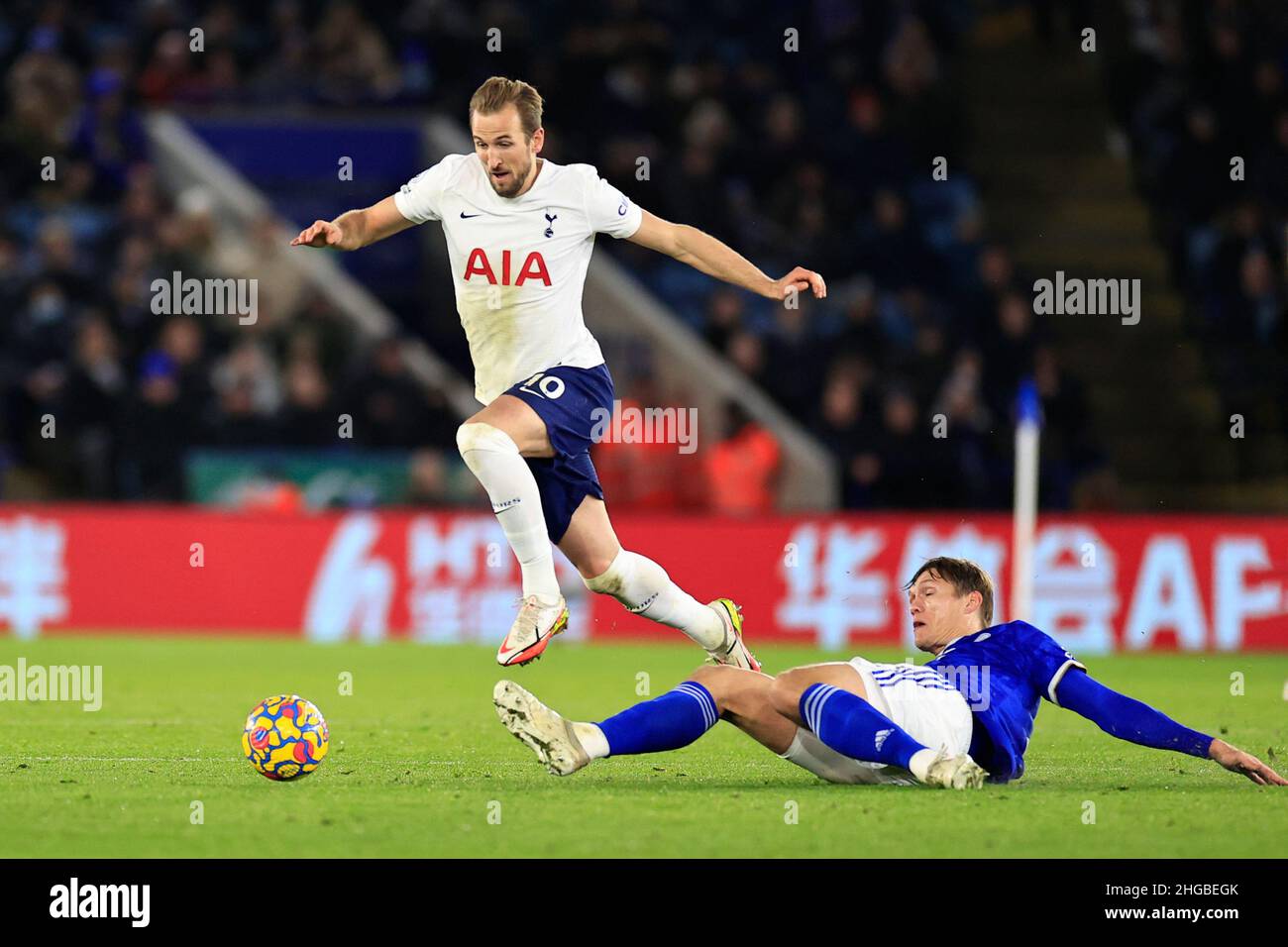 Harry Kane #10 of Tottenham Hotspur evades a challenge from Jannik Vestergaard #23 of Leicester City Stock Photo