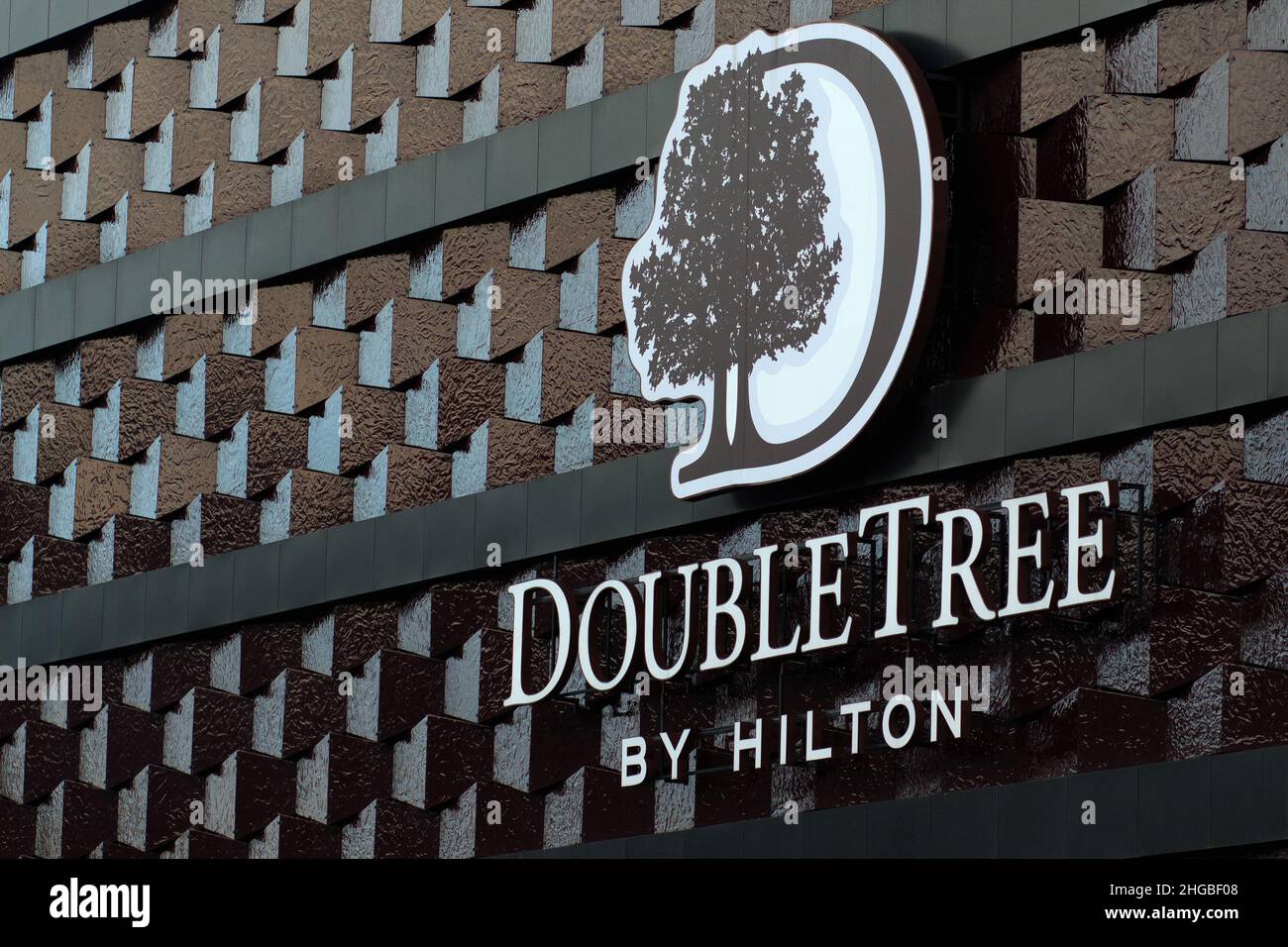 DoubleTree by Hilton. Logo on facade of the hotel building. Hotel in Minsk, Belarus. Stock Photo