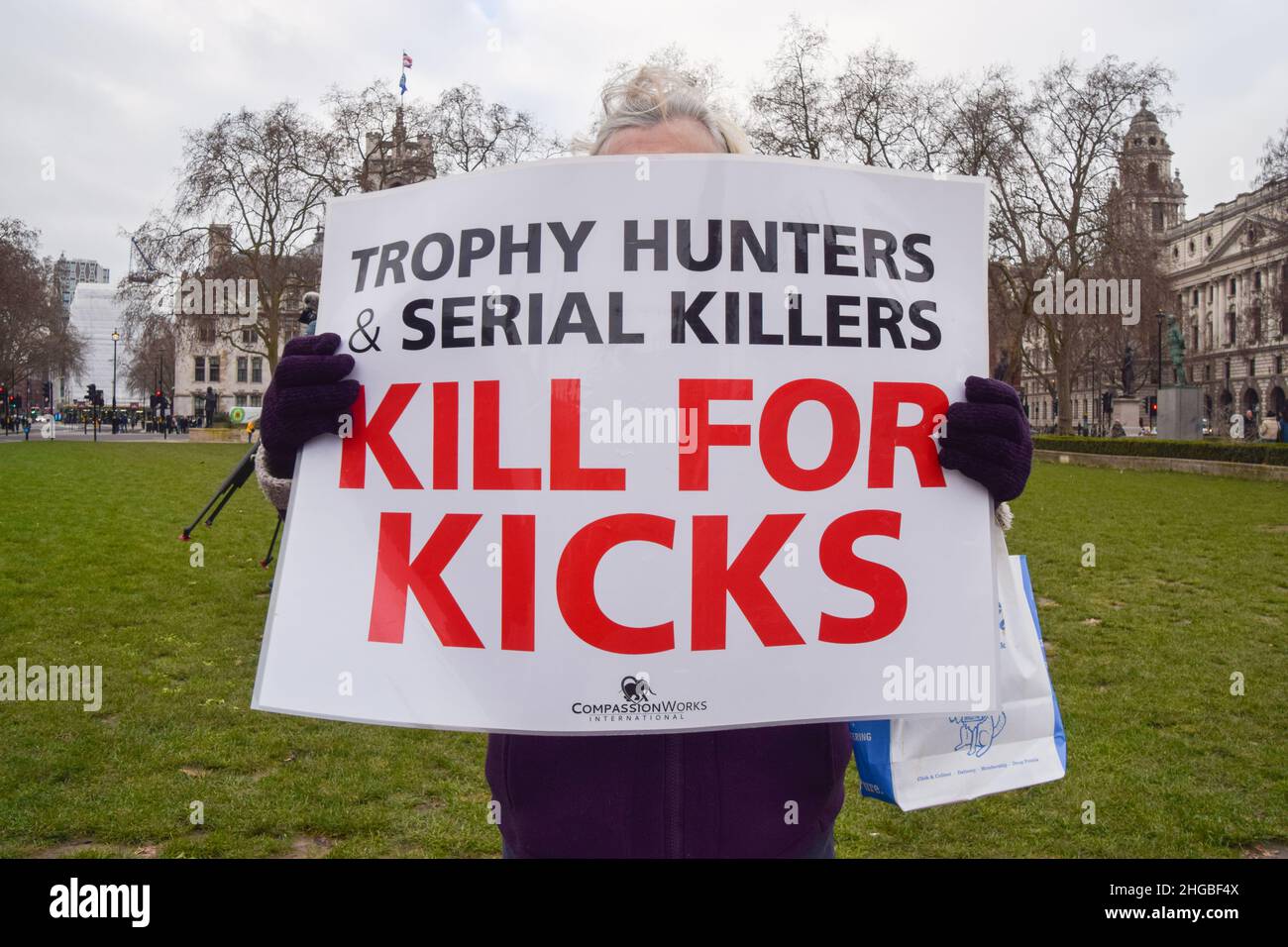 London, UK. 19th Jan, 2022. A protester holds an anti-trophy hunting placard during the Worldwide Rally Against Trophy Hunting.Activists gathered at Parliament Square calling for a ban on trophy hunting and trophy hunting imports. (Photo by Vuk Valcic/SOPA Images/Sipa USA) Credit: Sipa USA/Alamy Live News Stock Photo