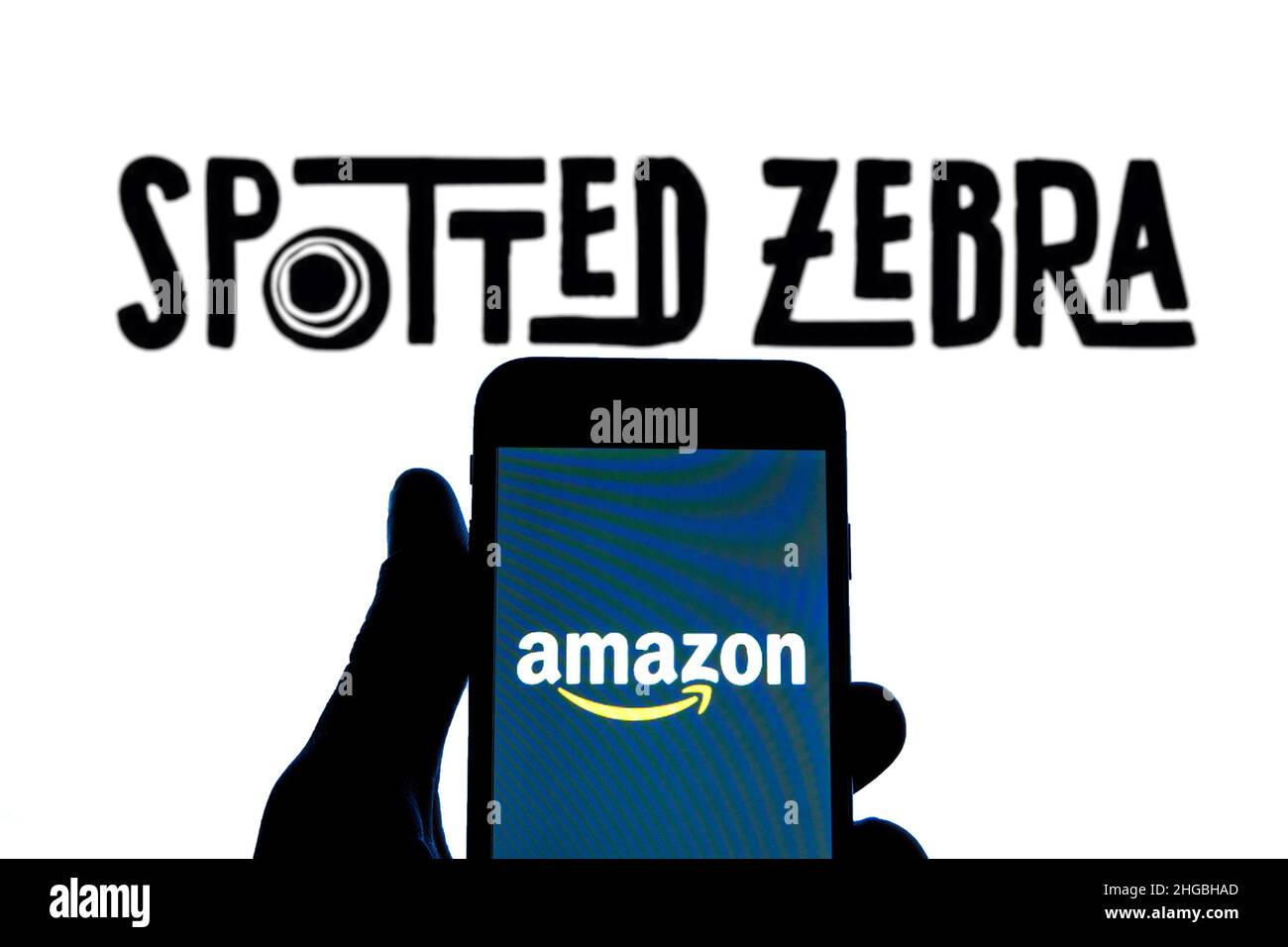 In this photo illustration an Amazon logo seen displayed on a