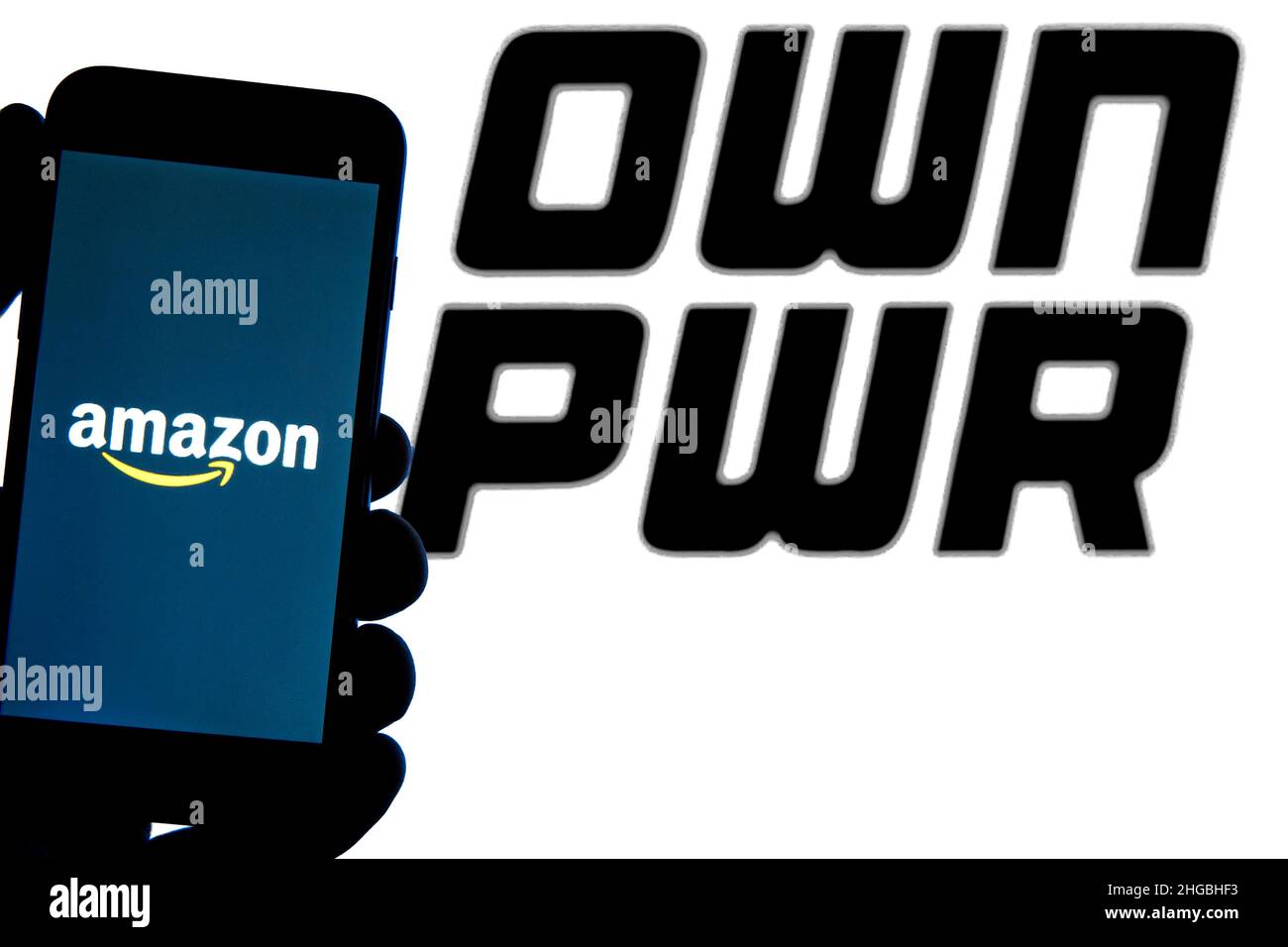 In this photo illustration an Amazon logo seen displayed on a