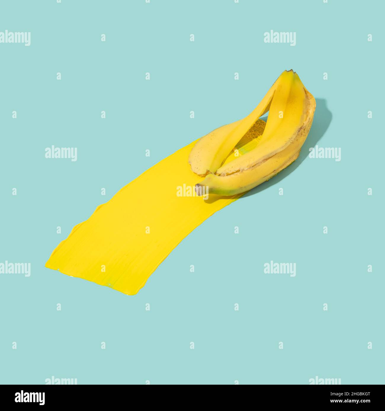 Slippery banana peel with a trail of yellow color behind. Learning from mistakes minimal concept