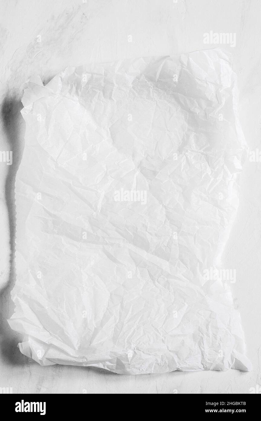 White empty crumpled baking paper background. Top view. Stock Photo
