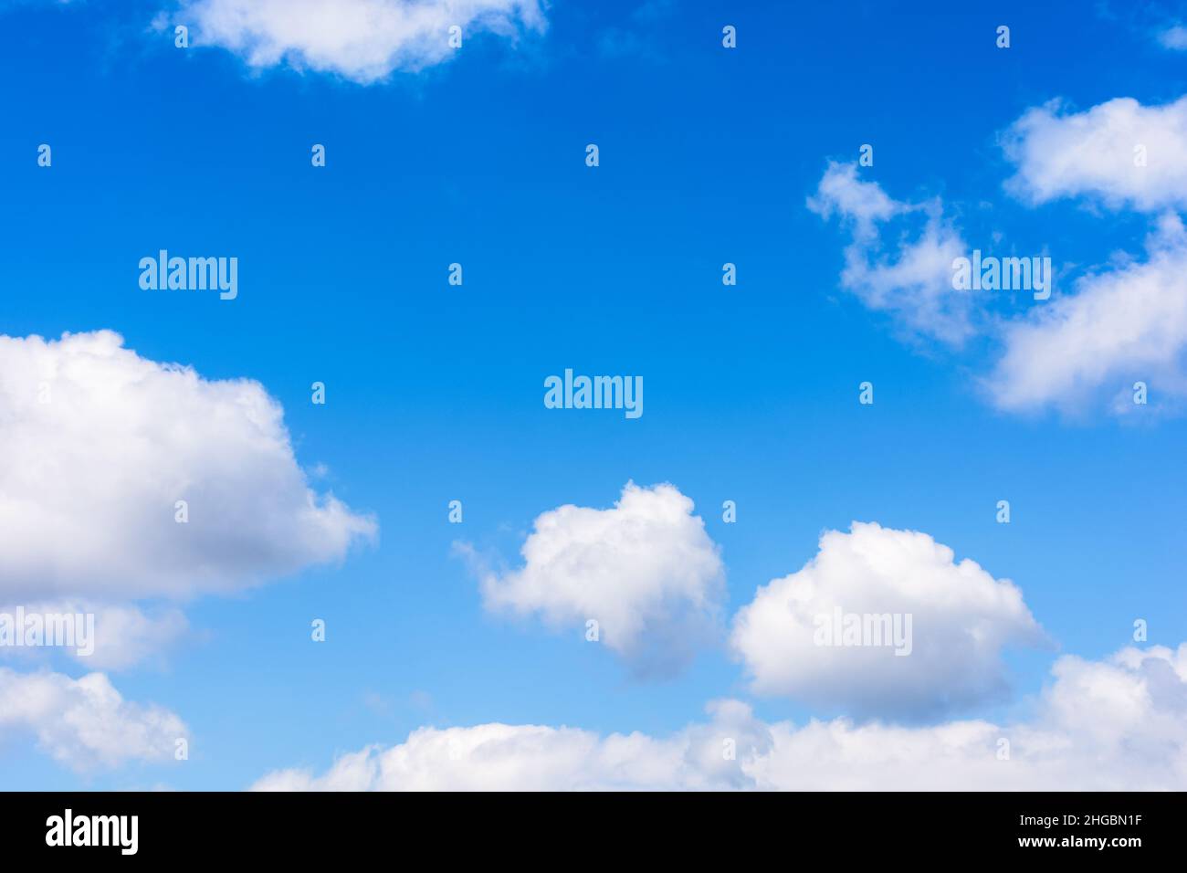 white fluffy clouds on the azure sky. calm weather in spring. beautiful nature background Stock Photo