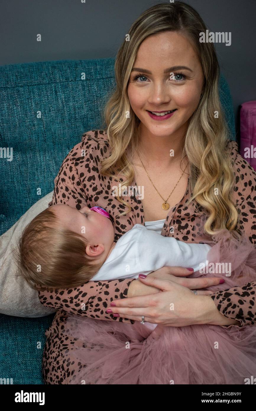 A proud young mother & baby, 1st birthday Stock Photo Alamy