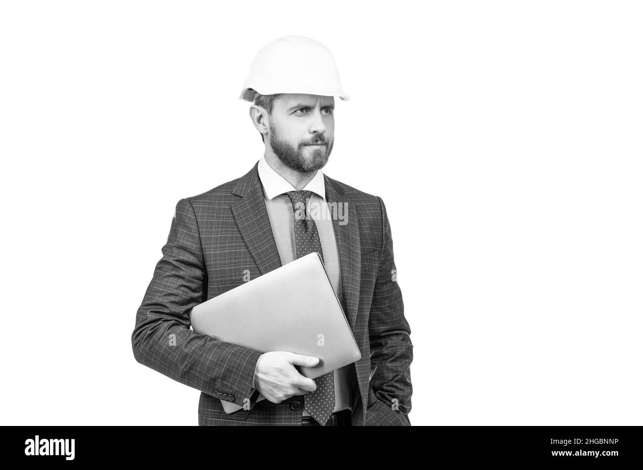 confident businessman man in suit and helmet hold computer isolated on white, architect Stock Photo