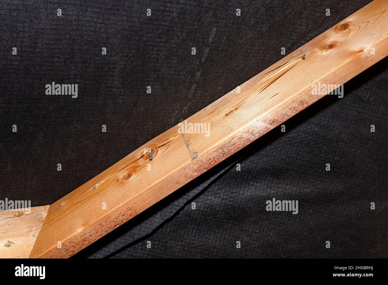 Badly nailed nails connecting the roof truss covered with a membrane on