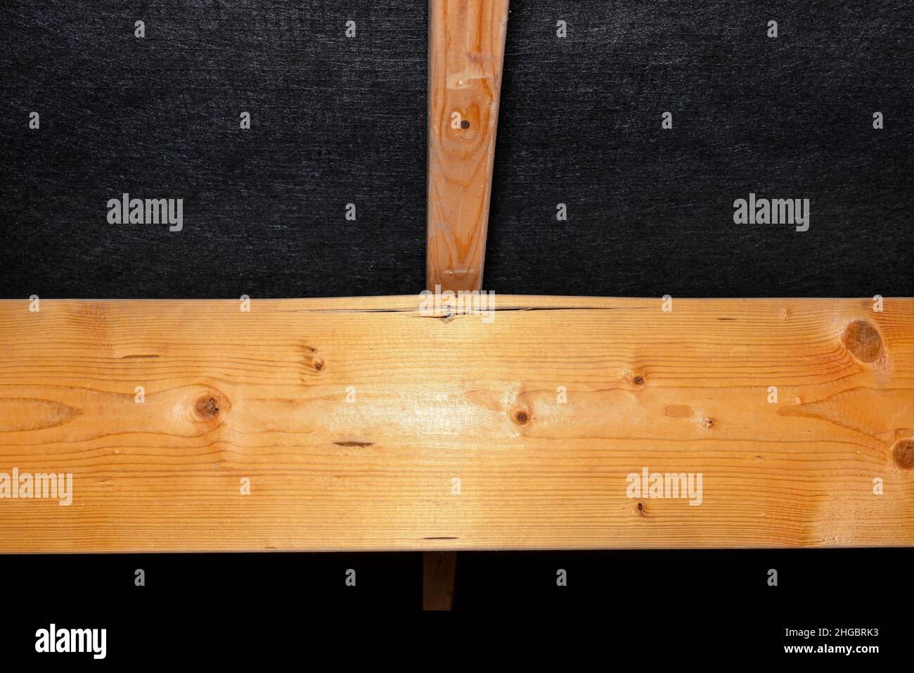 Badly nailed nails connecting the roof truss covered with a membrane on