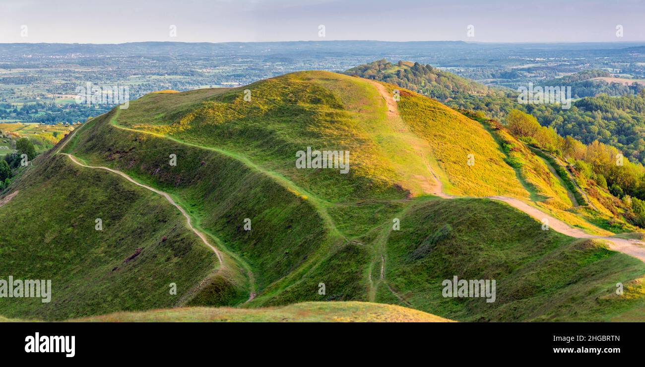 Low angled summer morning sunlight,clipping the summit and pathways of ...